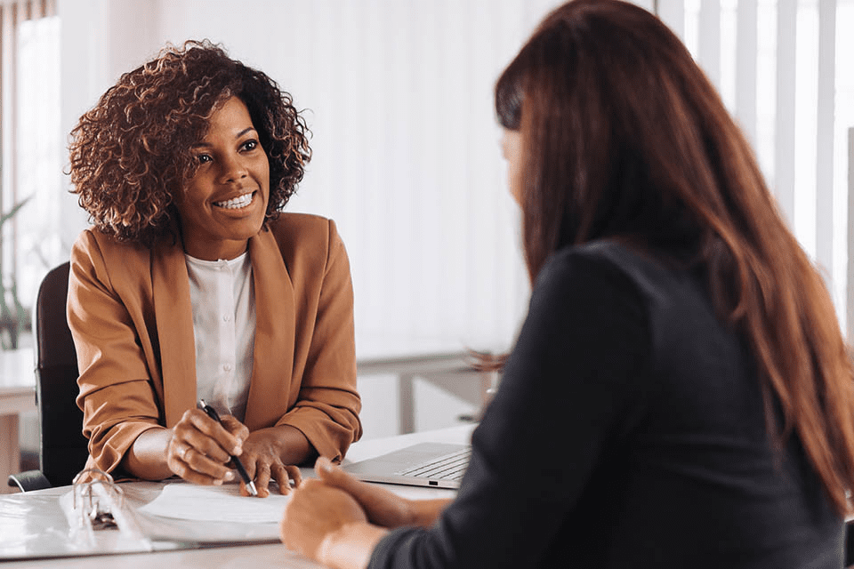 Attractive positive young businesspeople and colleagues in a call center office